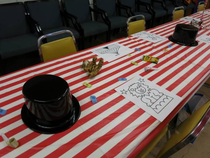 Instead of traditional party hats, I set out ring master style top hats for guests. I also printed circus theme coloring pages to decorate the tables along with boxes of crayons, bean bag circus animals, and tickets.